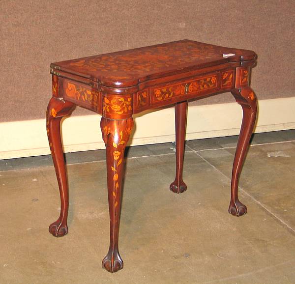 Appraisal: A Queen Anne style mahogany and marquetry games table late