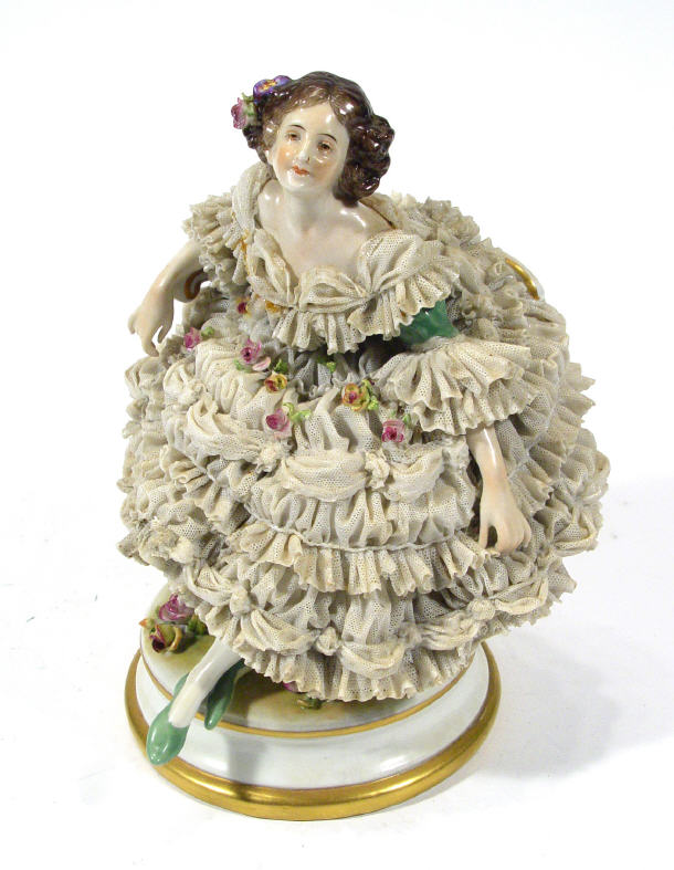 Appraisal: Hand painted Continental porcelain figurine in a lacework dress relief