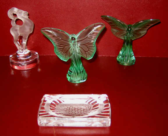 Appraisal: LALIQUE FRANCE Clear and frosted glass RAM figure on circular