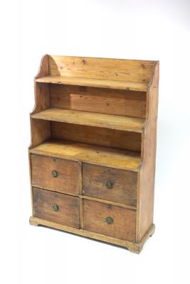 Appraisal: A Victorian pine cabinet with shelves above four drawers cm