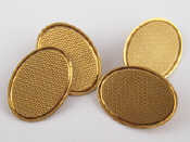 Appraisal: A boxed pair of oval ct gold cufflinks with engine