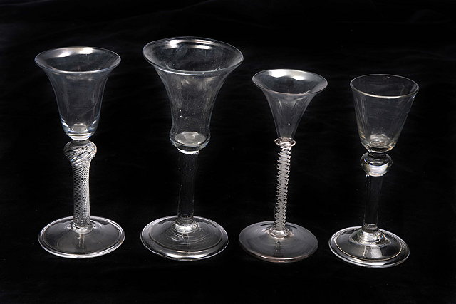 Appraisal: AN ANTIQUE WINEGLASS with fluted base to the bowl plain