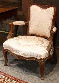 Appraisal: Louis XV walnut fauteuil en cabriolet Louis XV walnut fauteuil