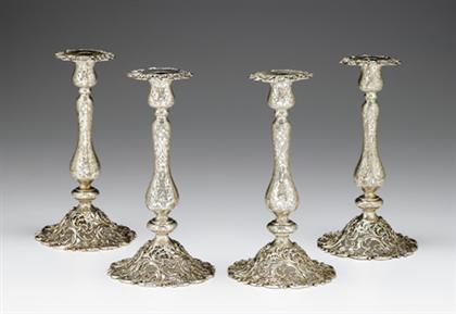 Appraisal: Set of four sterling silver pierced candlesticks retailed by j