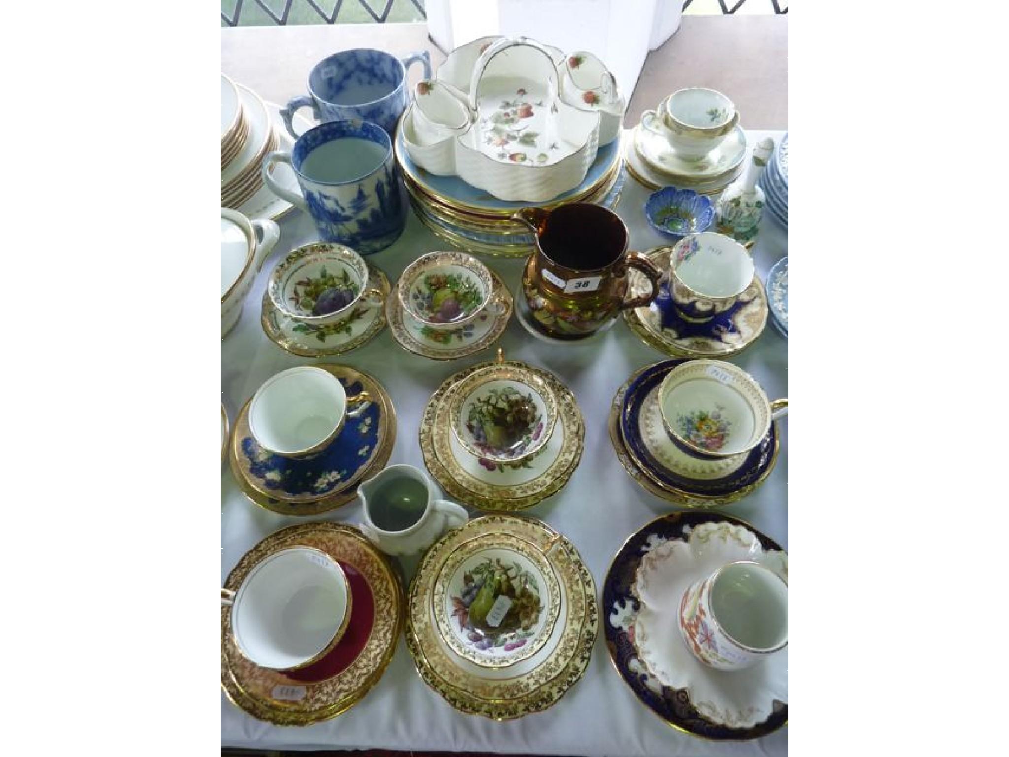 Appraisal: An interesting collection of teawares comprising nine cups and saucers