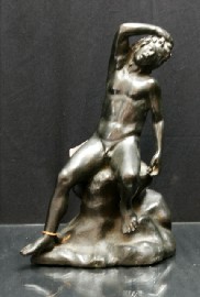 Appraisal: A bronze figure of a satyr Satyr on a rocky