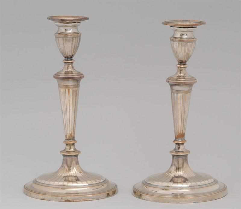 Appraisal: PAIR OF GEORGE III SHEFFIELD PLATE CANDLESTICKS Each tapered fluted