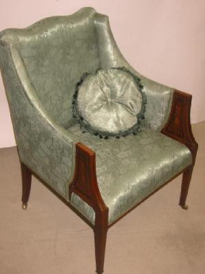 Appraisal: AN EDWARDIAN SALON ARMCHAIR upholstered in green damask covering arched