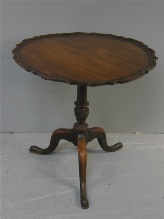 Appraisal: George III mahogany tilt top table with shaped top on