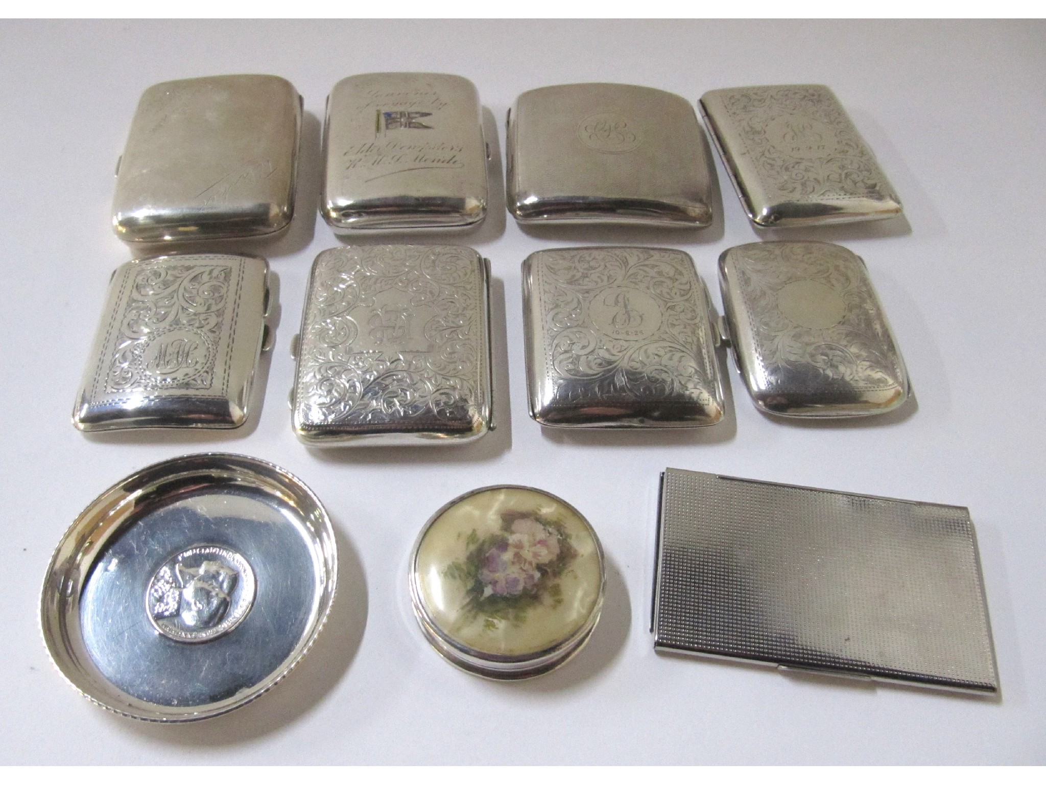 Appraisal: A lot comprising eight silver cigarette cases a white metal