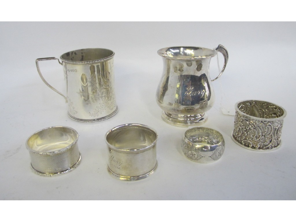 Appraisal: Lot comprising two silver christening mugs and four silver napkin