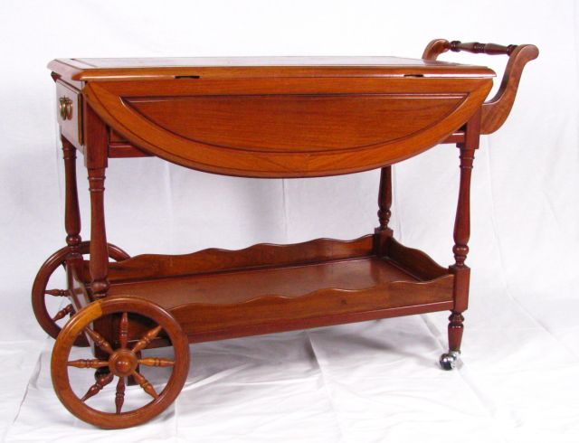 Appraisal: Rosewood serving cart traditional style with drop leaf top