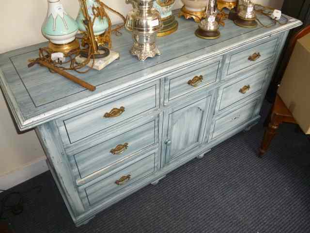 Appraisal: A BLUE PAINTED SIDEBOARD with seven drawers around a central