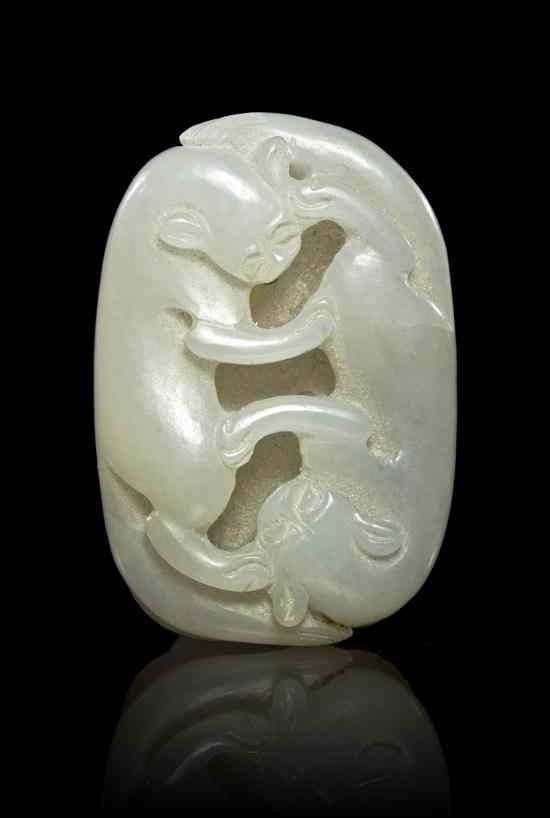 Appraisal: A Jade Toggle of Two Beasts of oval form depicting