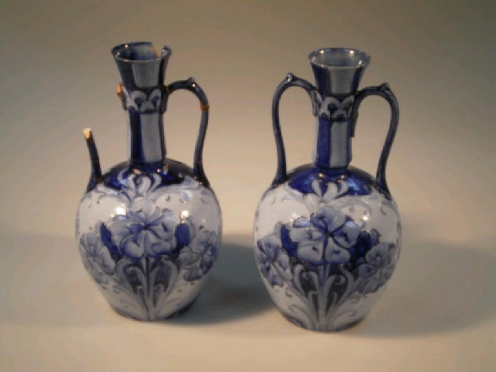 Appraisal: A pair of Moorcroft MacIntyre Florian ware two-handled ovoid vases