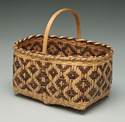 Appraisal: Cherokee river cane basket brown weavers diamond pattern lock handle