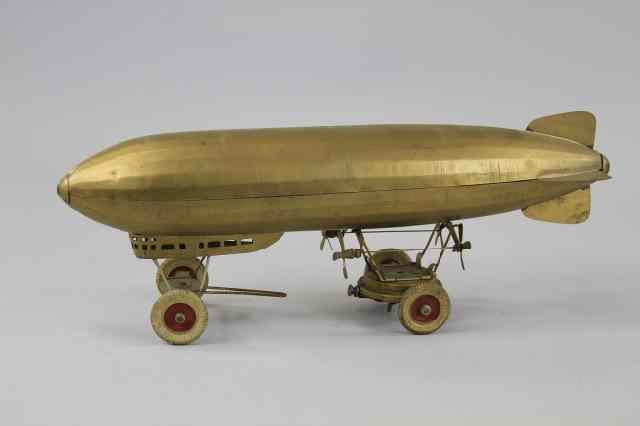 Appraisal: KINGSBURY CLOCKWORK DIRIGIBLE C rare example pressed steel done in