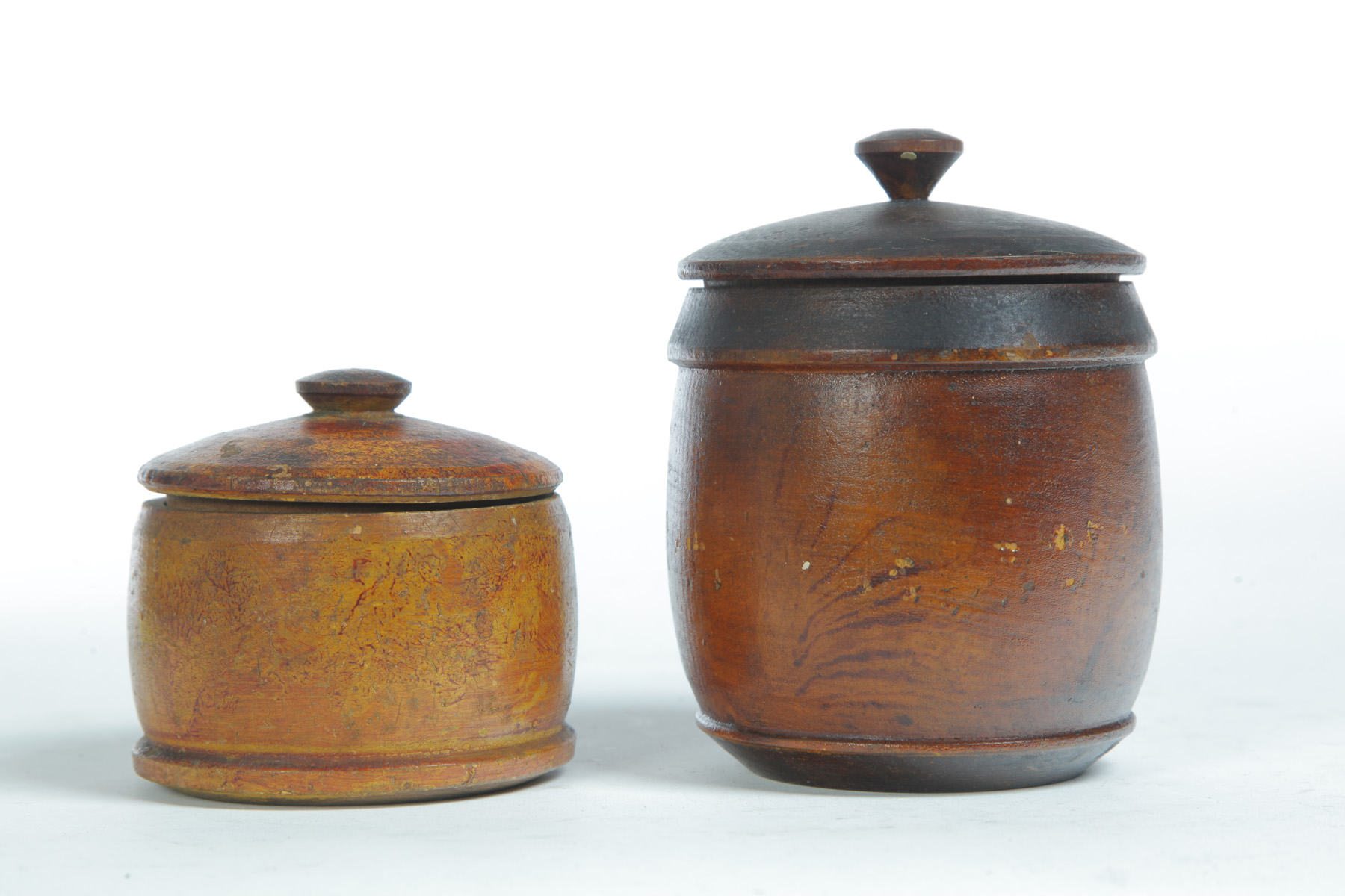 Appraisal: TWO AMERICAN DECORATED TREENWARE JARS Mid th century Covered jars