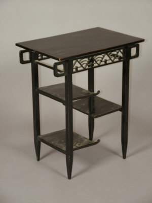 Appraisal: An Art and Crafts ebonised occasional table the rectangular top