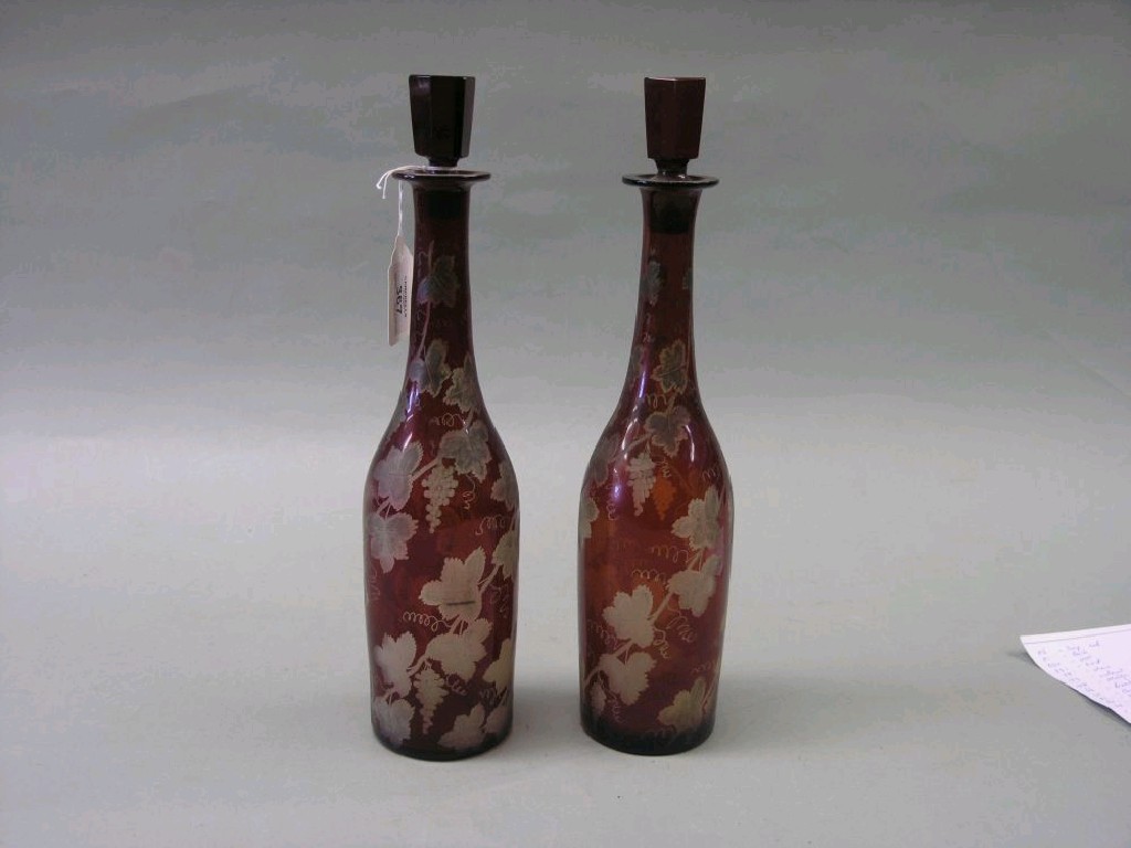 Appraisal: A pair of late th century Bohemian glass decanters engraved