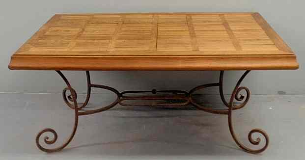 Appraisal: Wrought iron garden table with an inlaid mixed wood top