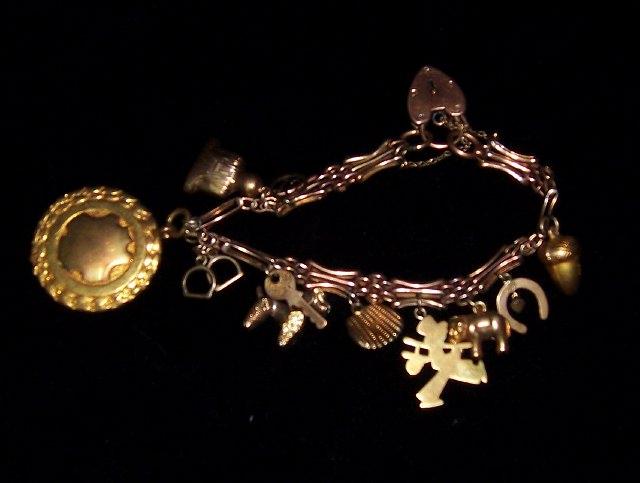 Appraisal: A carat gold bracelet with heart shaped padlock clasp hung