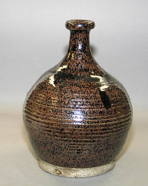 Appraisal: A temmoku glazed pottery storage bottle and a temmoku glazed