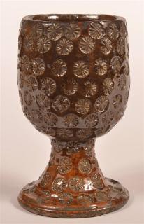 Appraisal: th Century Glazed Redware Pottery Goblet Stamped rosette decoration h