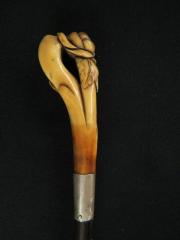 Appraisal: Carved Ivory Handled Walking Stick flower decor silver band long