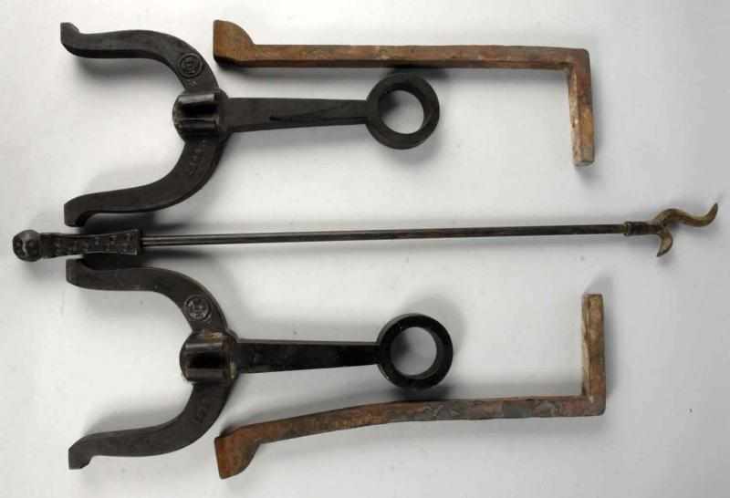 Appraisal: Pair of Hand Wrought Iron Andirons Description Both with an