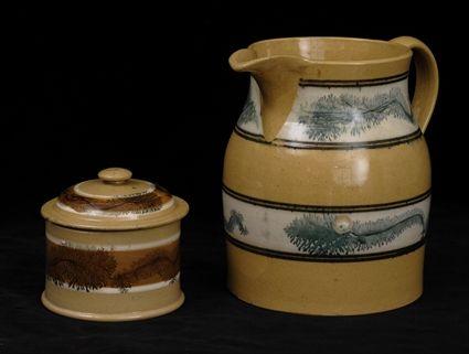 Appraisal: YELLOWWARE PITCHER AND COVERED JAR Each with bands of seaweed