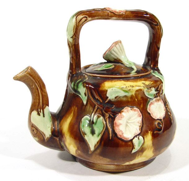 Appraisal: Continental Majolica teapot and cover with floral knop moulded with