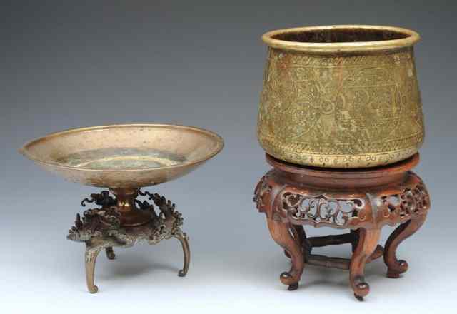 Appraisal: A PERSIAN BRASS ENGRAVED BOWL with hardwood stand and a