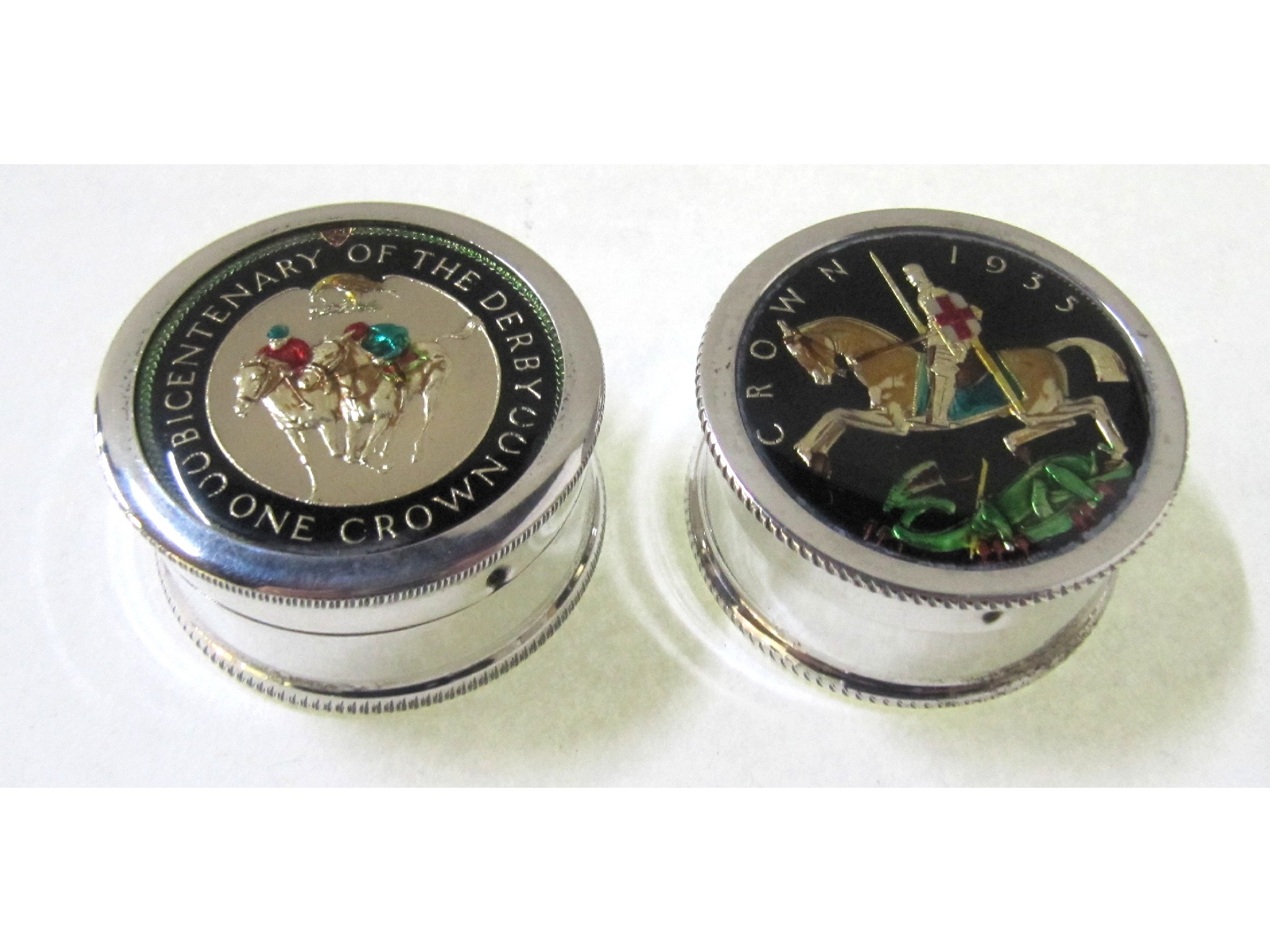 Appraisal: A lot comprising two silver pill boxes the lids set