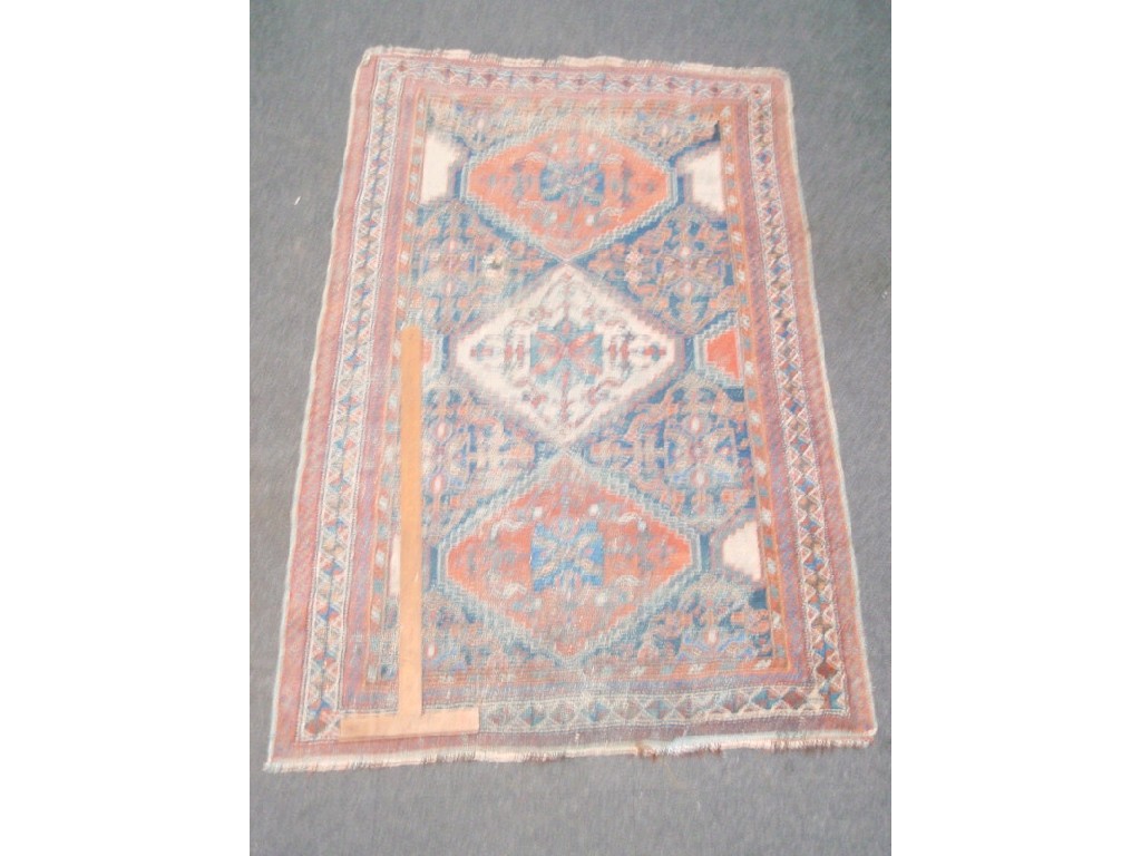 Appraisal: A Turkish blue ground tri-medallion rug with multi-borders cm x