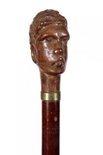 Appraisal: African Wood Dress Cane- A carved African warrior with metal