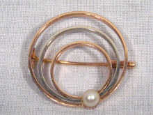 Appraisal: A carat two colour gold circular brooch set with a