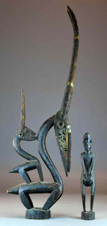 Appraisal: African Hardwood CarvingsTo include a beastlike figure with pronounced beek