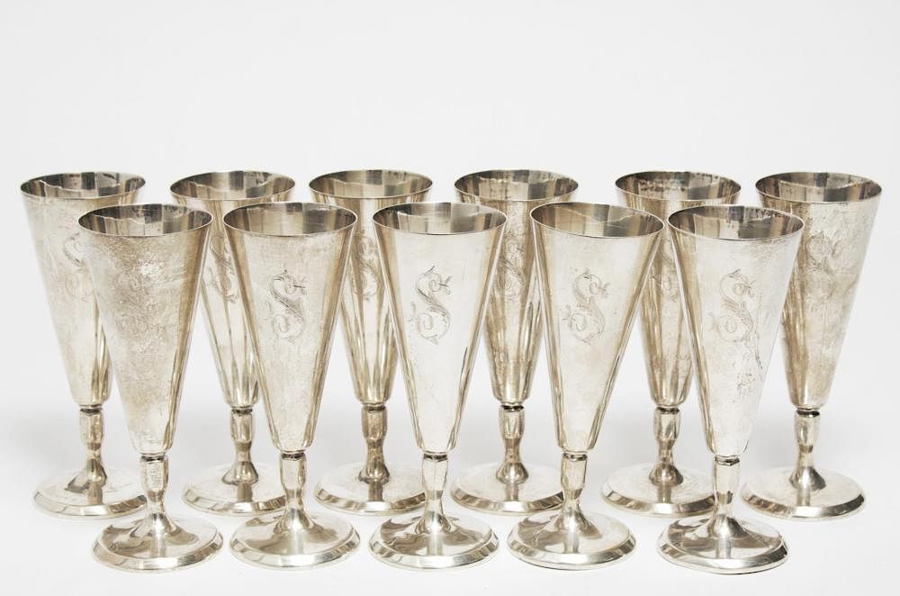 Appraisal: Mid-Century Silver-Toned Wine Goblets Mid-century Modern silver-toned wine goblets or