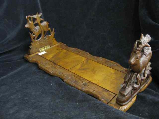 Appraisal: Black Forest Carved Bookstand deer decor telescopic drop sides ''