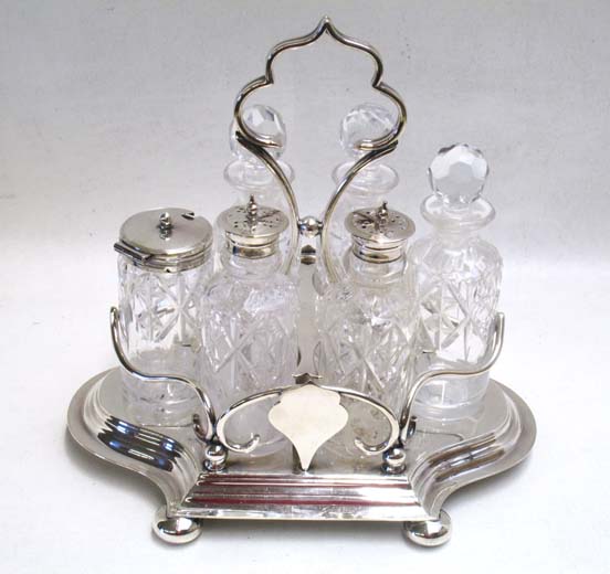 Appraisal: SHEFFIELD SILVER PLATED CASTOR SET with cut crystal decanters by