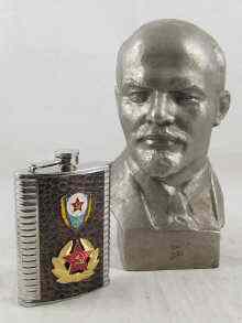 Appraisal: A metal bust of Lenin measuring approx cm high together