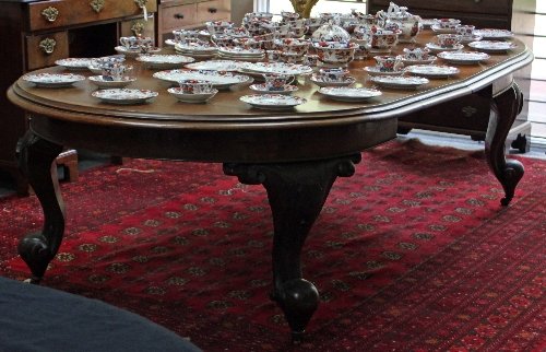 Appraisal: A th Century mahogany dining table with D-shaped ends raised