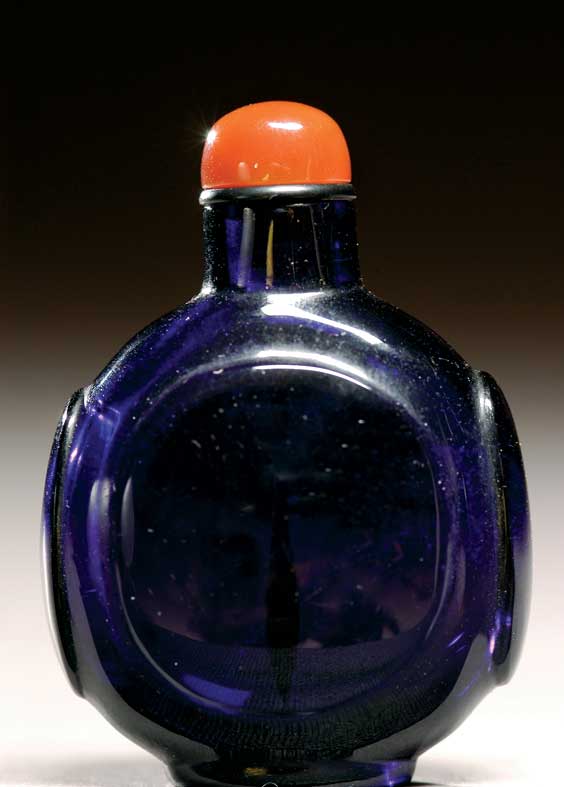 Appraisal: ANTIQUE GLASS SNUFF BOTTLE Antique dark translucent amethyst glass snuff