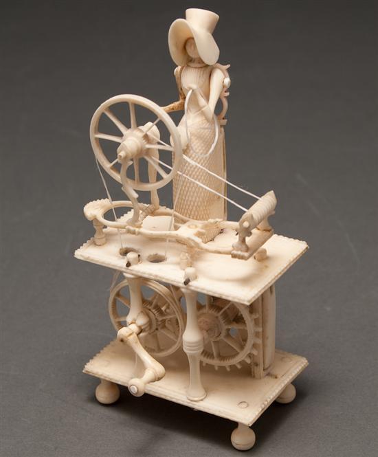 Appraisal: Continental carved ivory figure of a woman at spinning wheel