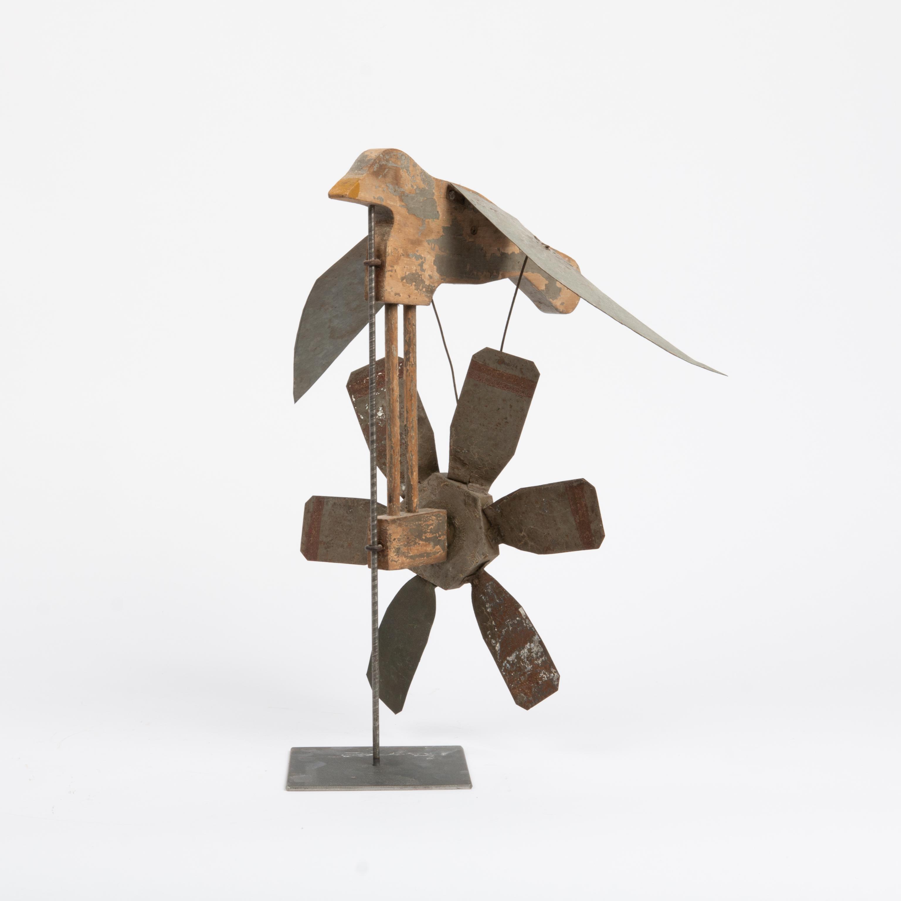 Appraisal: FOLK ART BIRD WHIRLIGIG A carved wood bird with zinc