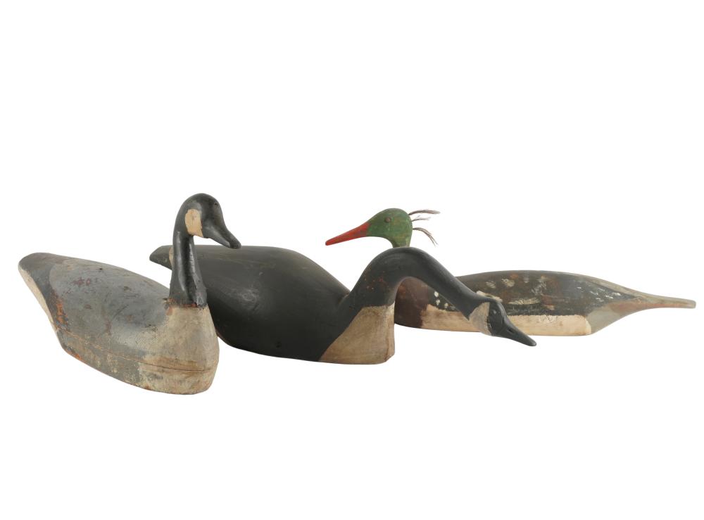 Appraisal: THREE DUCK DECOYSpainted wood and inches wide Condition