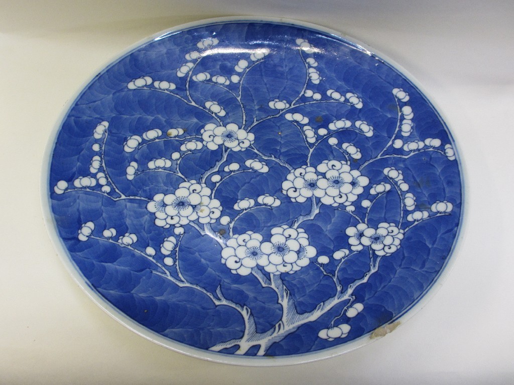 Appraisal: Chinese blue and white charger decorated with prunus