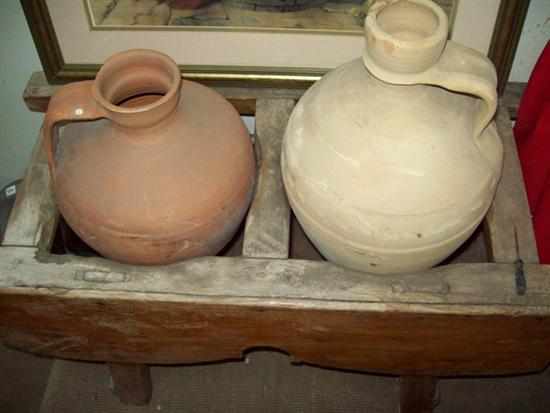 Appraisal: TWO TERRACOTTA BOTTLES IN AN ANTIQUE PINE STAND