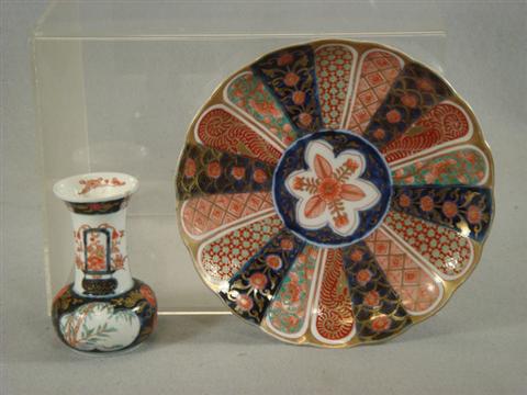 Appraisal: Imari plate with a small Imari vase th c Estimate